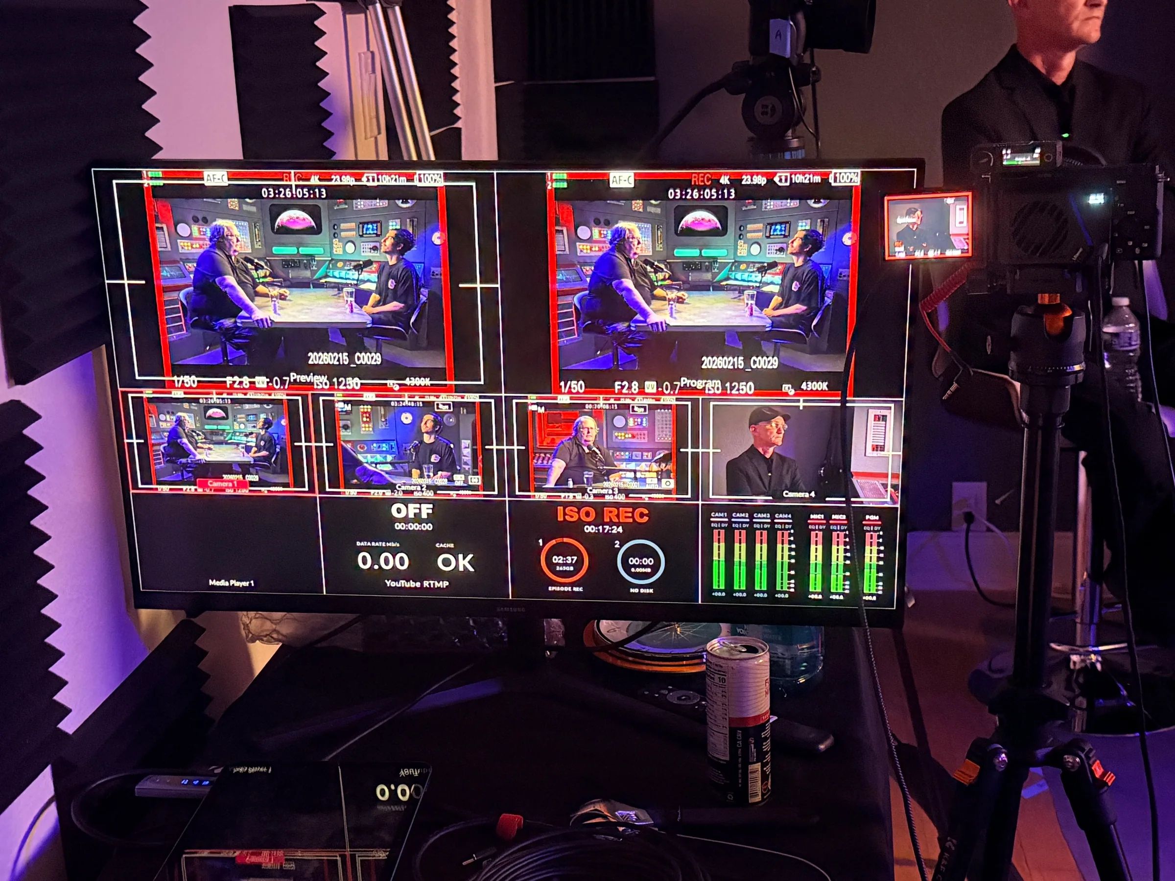 A multiview monitor shows every camera angle of a two-person podcast, each one recording