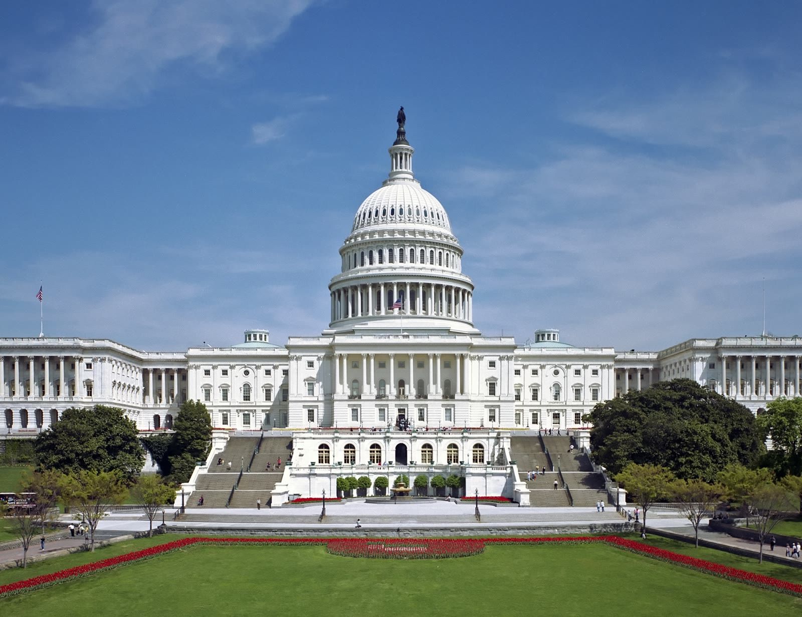 The west front of the U.S. Capitol in Washington, DC, under a blue sky