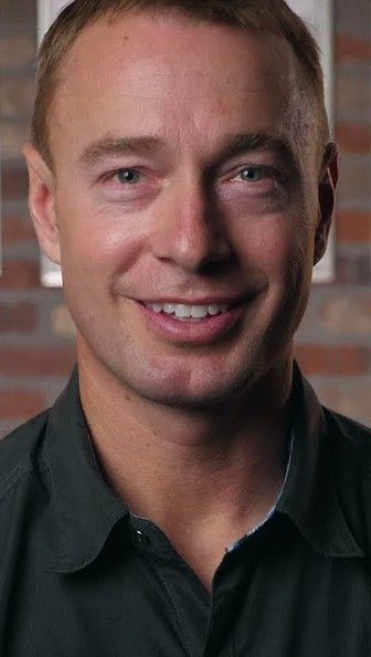 Scott, a Vein Envy patient, smiling in a vertical clip cut for social.